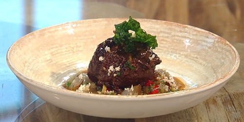 Slow-cooked beef cheek with roast onion dressing and fried kale