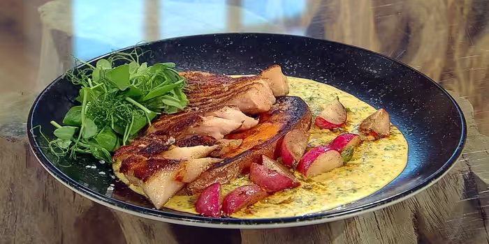Smoky pork chops with West Indian-style salsa verde served on plate