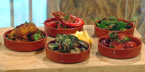 Angelas-tapas-–-prawns-cod-fritters-clams-padron-peppers-and-chorizo.jpg