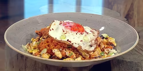 Bacon-and-kimchi-fried-rice-with-chilli-burnt-corn-and-crispy-fried-egg.avif
