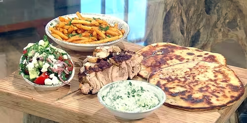 Chicken-gyros-with-tzatziki-and-chips.avif