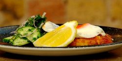 Chicken-schnitzel-with-fried-eggs-and-parsley-salad.jpg