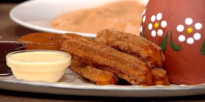 Churros-with-three-dipping-sauces.avif