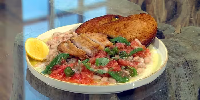 Crispy-chicken-thighs-with-white-beans-and-tomato-dressing.avif