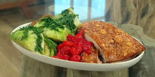 Crispy-pork-belly-with-caramelised-strawberries-cider-sauce-herb-roasted-potatoes-and-charred-cabbage-wedges.avif
