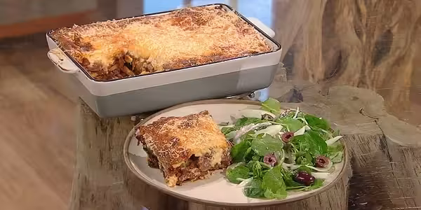 Moussaka-with-fennel-salad.avif