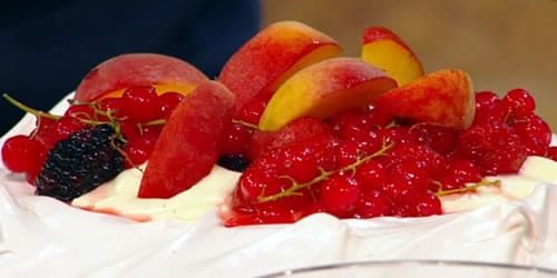 Pavlova-with-ruby-port-reduction-and-poached-summer-fruits.jpg