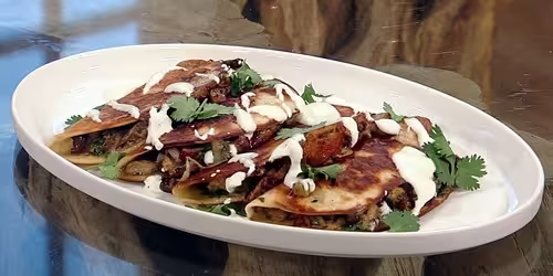 Pork-and-black-bean-birria-tacos.avif