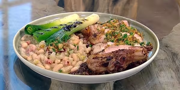 Pork-chops-with-tamarind-salsa-grilled-leeks-and-white-beans.avif