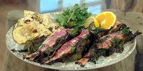 Red-mullet-wrapped-in-vine-leaves-with-artichoke-and-black-olive-socca-bread.avif