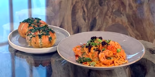 Roasted-garlic-and-gochujang-prawn-pasta-with-cream-cheese-garlic-bread.avif