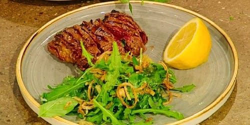 Stuffed-grilled-flank-steak-with-roasted-garlic-basil-pecorino-crisp-shallots-and-rocket.jpg