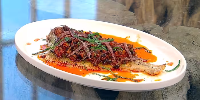 Whole-grilled-sole-with-olives-anchovy-and-tomato-vinaigrette.avif