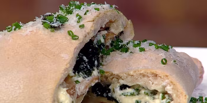 Wild-garlic-mozzarella-potato-and-wild-mushroom-calzone.avif